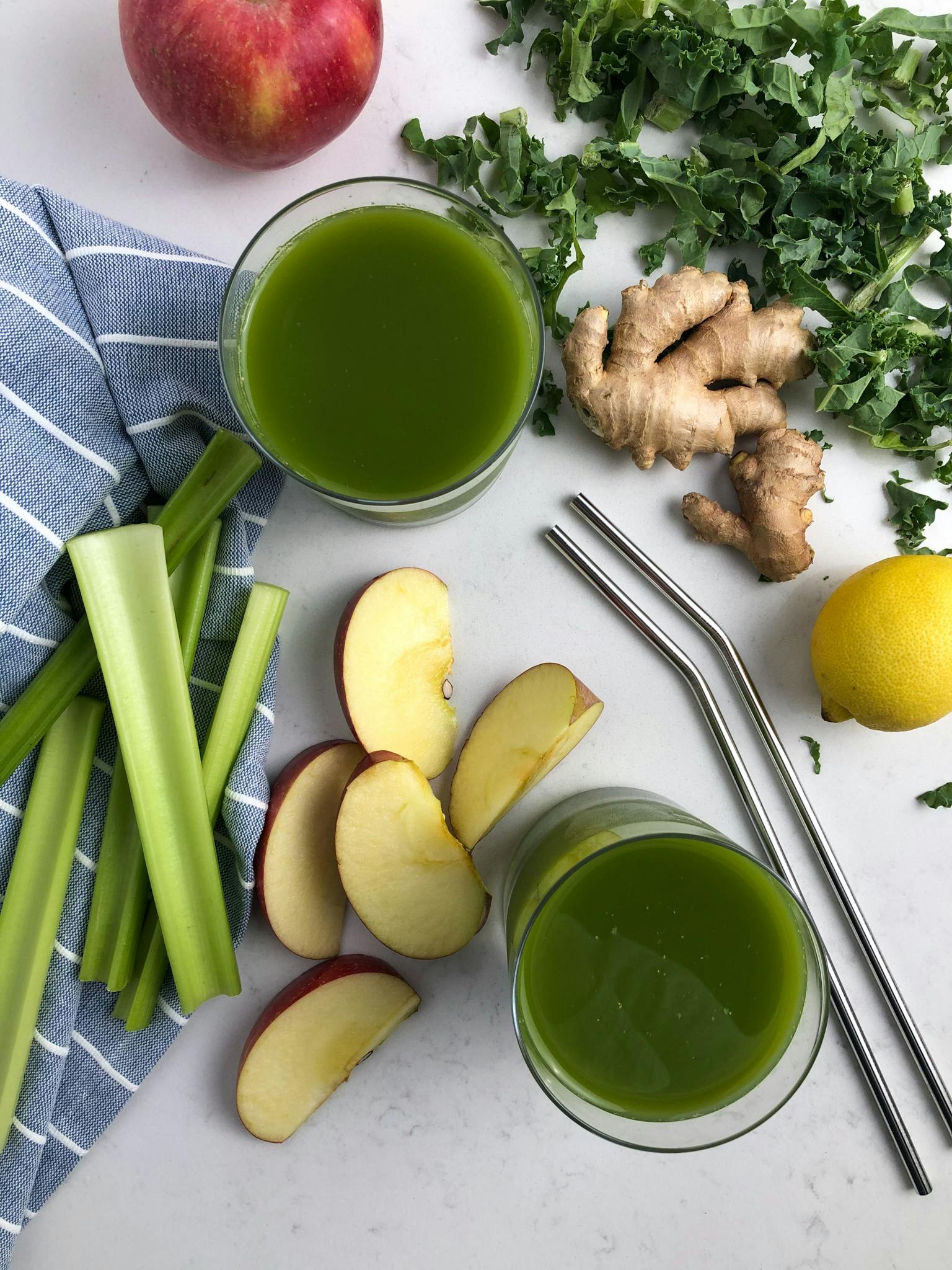 Flat lay photo of the green juice and some of the ingredients.